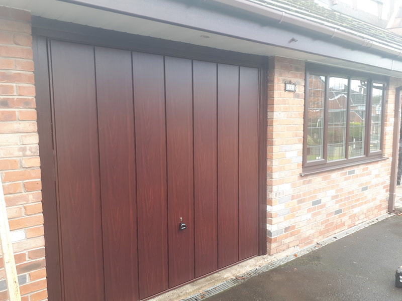 Brand new up and over garage door installed in Cheshire.